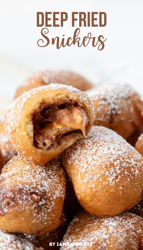 A pile of deep fried snickers.  The top dessert has a bite taken from it, showing the candy center. Deep Fried Snickers Recipe, Deep Fried Snickers, Fried Snickers, Deep Fried Desserts, Snickers Recipe, Easy Impressive Dessert, Fair Foods, Morning Recipes Breakfast, Fried Dessert