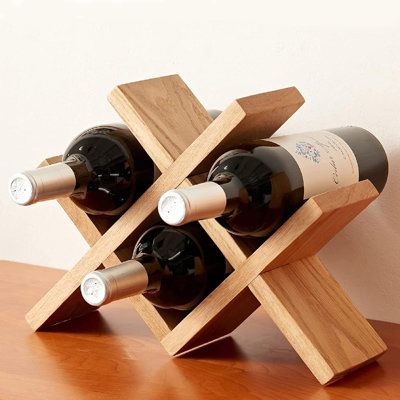 Space Saving Design- The small wine racks countertop measures 12.8 x 3.93 x 9.3 inch, which has room for up to 4 standard bottles(Diameter less than 3.34inch) of your favorite wine. The small, rustic, and simple design fits anywhere in your home! Beside the wine, you can store your liquor, champagne, etc. Finish: Light Brown | Loon Peak® Wine Rack Countertop Oak Wooden Wine Bottle Holder Rustic Free Standing Wine Storage Racks For Tabletop | 4 | Wayfair Small Wood Plant Stand, Wood Projects That Sell Ideas, Wooden Projects To Sell, Diy Wood Projects To Sell, Wooden Kitchen Decor, Wine Rack Countertop, Cellar Basement, Wooden Wine Bottle Holder, Small Wine Racks