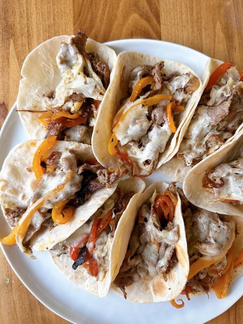 Trader Joe’s Philly Cheesesteak Tacos — The Hungry Hooker Philly Cheesesteak Tacos, Cheesesteak Tacos, Dill Pickle Salad, Pickle Salad, Shaved Beef, Chicken Rice Bake, Sweet Potato Nachos, Sheet Pan Dinners Chicken, Taco Ingredients