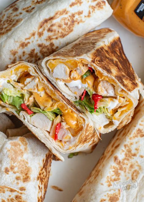 Chipotle Ranch Grilled Chicken Burrito is a copycat Taco Bell Burrito with chicken, tortillas, tomato, cheese, lettuce, chipotle ranch sauce. Copycat Taco Bell Chipotle Ranch Grilled Chicken Burrito, Taco Bell Chipotle Ranch Chicken Burrito, Chipotle Ranch Grilled Chicken Burrito, Taco Bell Burrito, Chipotle Ranch Chicken, Burrito Ideas, Burritos Recipes, Chicken Burrito Recipe, Mexican Recipies