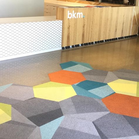 @shawcontract_sandiego on Instagram: “BKM showroom featuring Hexagon-shaped carpet tiles from the Configure Collection. The perfect choice to go with the reception desk.” Carpet Inspiration, Shaw Contract, Concrete Floor, Gaming Room, Reception Desk, Music Studio, Carpet Tiles, Concrete Floors, Game Room