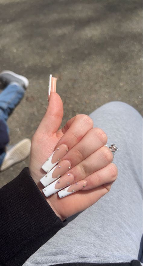 White French Tip Nails With Blue Rhinestones, Long White French Tip Nails With Gems, Long White French Tip Nails With Rhinestones, V Shaped French Tip Nails With Gems, French Top With Gems, White Frenchies With Rhinestones, White French Nails With Diamonds, French Nails With Stones, White French Tip With Gems