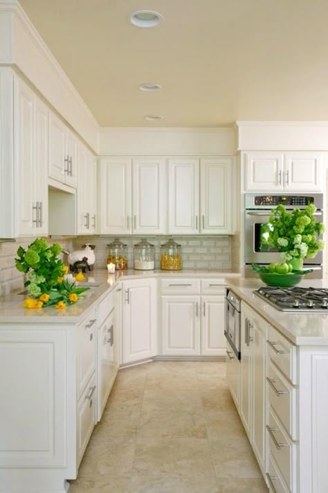 Paint everything white and that will instantly update your room.  The yellow/beige shade of the floors don’t distract at all from this crisp white kitchen.  The travertine tiles are all the same size and looks more contemporary. White Granite Countertops, Painted Kitchen Cabinets Colors, Travertine Floors, Painted Floor, White Quartz Countertop, Kitchen Floor Tile, Transitional Kitchen, Kitchen Redo, Trendy Kitchen