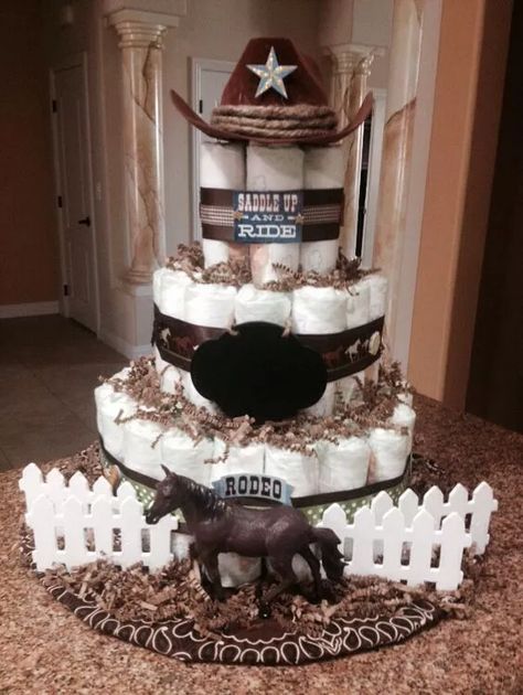 23 Creative Cowboy Themed Baby Shower Ideas 2022 Cowboy Diaper Cake Boys, Western Diaper Cake Boys, Western Boy Baby Shower Ideas, Horse Baby Shower Ideas, Horse Diaper Cake, Western Diaper Cake, Cowboy Baby Shower Ideas, Cowboy Themed Baby Shower Ideas, Cowboy Diaper Cake