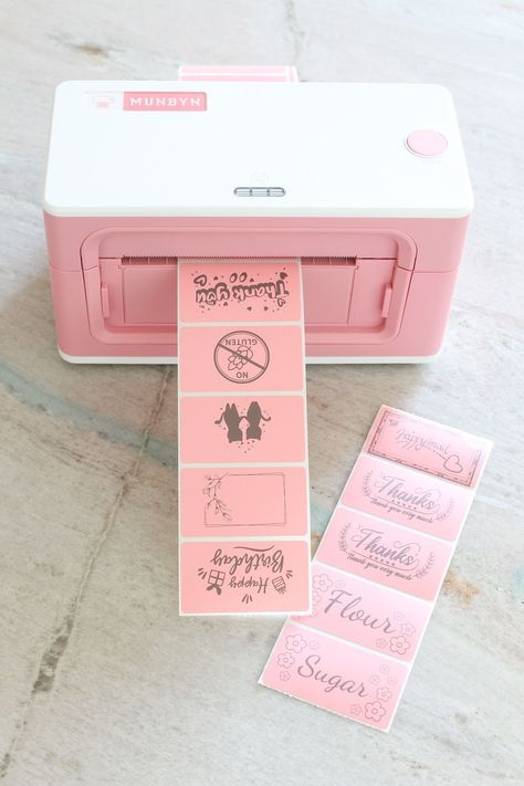 A company called Munbyn sent me the MOST adorable wireless thermal label printer (a Bluetooth Thermal Printer) and today I’m sharing my review. It's such a practical label printer – especially if you want to make easy DIY pantry labels, label things around the house, create custom gift labels, or you own a small business. If you’re self employed, a Munbyn thermal printer can print shipping labels, DIY care labels, customized brand stickers and so much more. Mini Thermal Printer Ideas, Easy Diy Pantry, Diy Gift Labels, Printer Hacks, Diy Pantry Labels, Branded Stickers, Diy Lunch Bag, Small Business Shipping, Diy Lunch