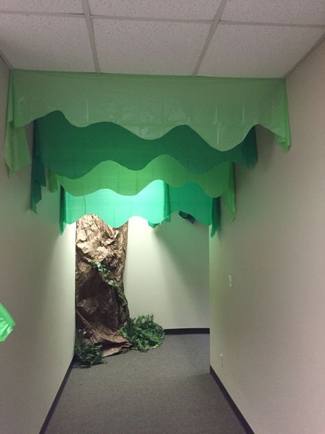 Tree hallway made from plastic table cloth Forest Hallway School, Tree Vbs Decorations, Vbs Forest Decorations, Table Cloth Ceiling Decorations, Forest Vbs Decorations, Aig Vbs Jungle Journey, The Great Jungle Journey Vbs Decorations, Answers Vbs Jungle Journey, Jungle Vbs Decorations