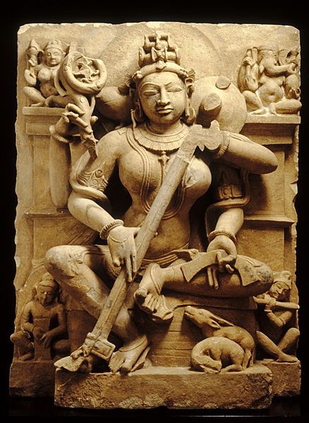 Saraswati — 10th century, sandstone. This sculpture once stood in a niche in a Hindu temple. Saraswati is a goddess who embodies the power of speech, of music (she is playing the stringed instrument known as the "vina"), and of learning (she holds a manuscript in her lower left hand). Temple Sculpture, Hindu Sculpture, Indian Statues, Khajuraho Temple, God Sculpture, Historical Sculptures, Indian Stone, Female Deity, Ancient Indian Art