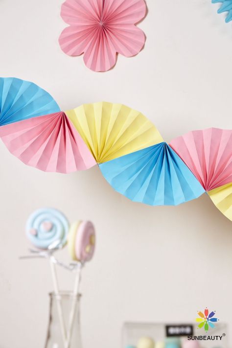 Featuring bright yellow, blue, and pink colors, these fun and unique decorations will add a touch of whimsy to your celebration. Paper Fan Garland, Fan Garland, Mosaic Paper, Garland Paper, Festive Party Decorations, Party Fans, Yellow Party, Paper Fan, Craft Craft