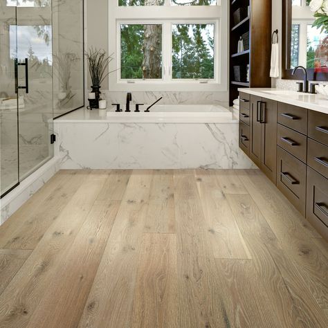 From waterproof (real!) hardwood floors to luxury vinyl, we've uncovered the 5 best flooring options for a bathroom remodel. #bathroomdesign #bathroomflooring #tilebathroom #flooringforbathroom          #bathroomrenovation European White Oak Floors, Basement Reno, Waterproof Bathroom, How To Waterproof Wood, Floor Bathroom, Oak Hardwood Flooring, White Oak Floors, White Oak Wood, Bathroom Reno