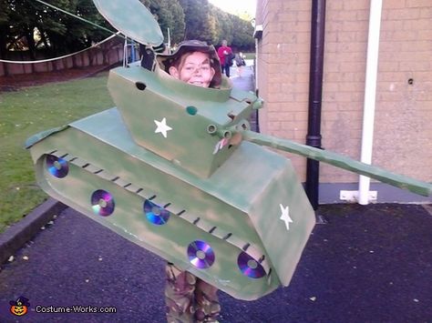 Adam: My brother is wearing the costume ,its made fron recycled cardboard from aldi,cds ,straws and hot glue.He loves the army and wanted to dress up as a tank ,it took... Tank Costume Diy, Diy Tank Costume, Army Tank Costume, Army Tank Halloween Costume, Tank Costume, Kids Army Costume, Pumpkin Sculpting, Annie Costume, Truck Crafts