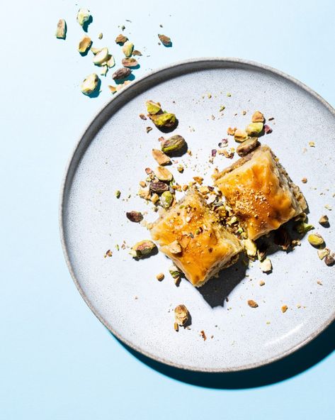 mezze dishes with sunny, harsh lighting and minimal styling. food photo with blue backdrop Baklava Photography Styling, Cold Baklava, Baklava Photography, Harsh Lighting, Christmas Content, Blue Backdrop, Blue Backdrops, Baklava, Food Photo