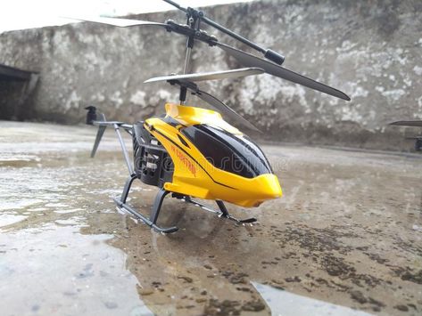 Photo about yellow black helicopter toy childrens. Image of helicopter, yellow, childrens - 145081558 Black Helicopter, Toy Helicopter, Helicopter Toy, Fitness Art, Photo To Cartoon, Snow Shovel, Yellow And Black, Editorial Illustration, Yellow Black