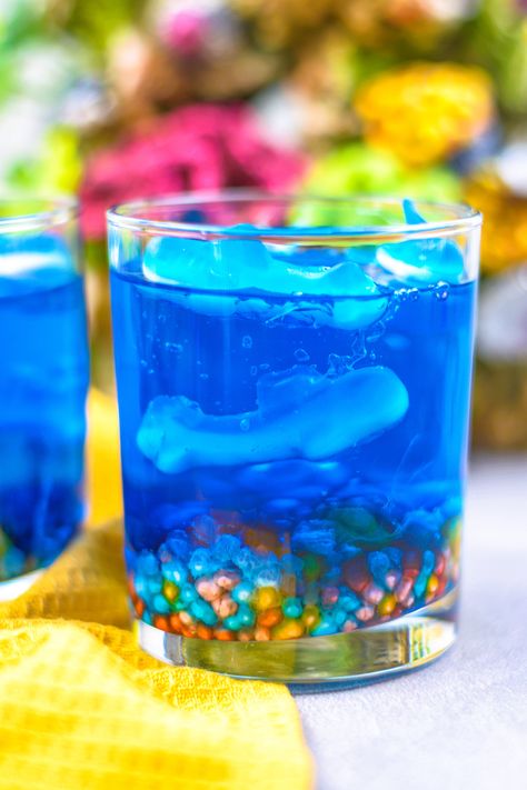 Shark Week Jello Aquarium 1 Jello With Gummy Sharks, Jello Fish Bowl, Water Themed Desserts, Shark Week Treats, Under The Sea Jello, Shark Jello Cups, Shark Week Snacks, Ocean Jello, Shark Jello