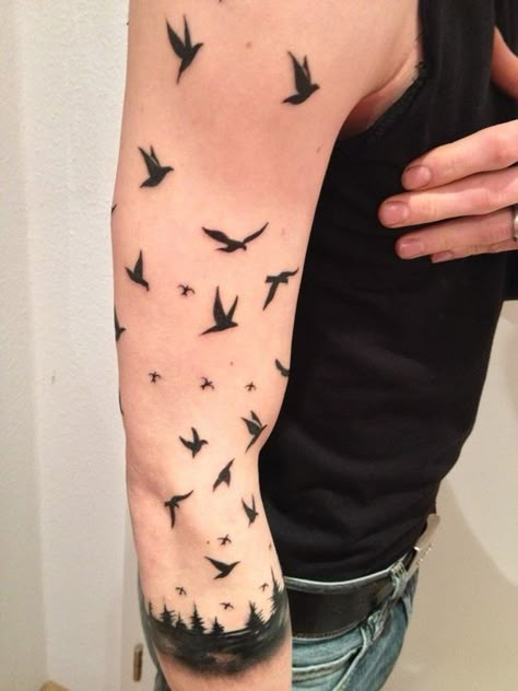 Feathered Ink: The Rise of Bird Tattoos Among Men 2023 - mens-club.online Color Bird Tattoo, Bird Tattoo Sleeves, Rabe Tattoo, Bird Tattoos Arm, Bird Tattoo Men, Crow Tattoo Design, Vogel Tattoo, Black Bird Tattoo, Forearm Band Tattoos