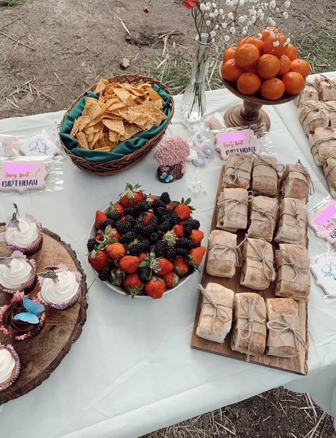 Fairy first birthday food with berries, sandwiches, chips and custom cookies Fairy First Birthday Food Ideas, Fairy First Birthday Food, First Birthday Food Ideas, First Birthday Food, Birthday Food Ideas, Fairy Garden Birthday Party, Garden Party Birthday, Garden Birthday, Birthday Food