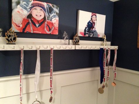 Medal and trophy display for the boys room - finally after a year of talking about it to them:) How To Display Trophies And Medals, Medal And Trophy Display, Hockey Shelf, Trophy Medal Shelf, Shelf For Medals And Trophies, Trophy Display Ideas, Dance Medals, Displaying Medals, Trophy Shelf Pottery Barn Teen