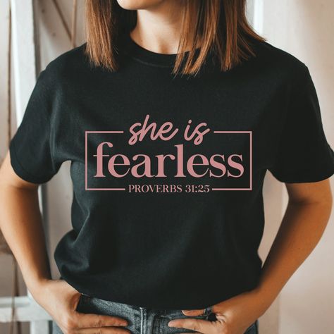 She is fearless Proverbs 31:25 Shirt, Faith Shirt, Religious Shirts, Lord Shirt, Christian shirt, Jesus Shirt, Unisex T-shirt Product Information All shirts are Unisex Gildan 100% Cotton. Please take a careful look at out sizing chart. Designs are applied with HTV (Heat Transferred Vinyl) and pressed with a Heat press. Washing Care Instructors Use cold water when washing, do not use bleach, do not dry clean, and do not use an iron directly on the design. Shipping Process * Your order will be rea She Is Fearless, Zombie Shirt, Christian Shirts Designs, Church Shirt, Jesus Shirt, Black Graphic Tees, Faith Shirt, Orange T Shirts, Concert Shirts