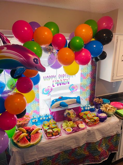 We got these inflatable dolphins and the garland from Amazon but the table turned out so cute! Lisa Frank Pool Party, Lisa Frank Dolphin Birthday Party, Birthday Fun Ideas, Lisa Frank Dolphin, Lisa Frank Birthday, Lisa Frank Party, Lisa Frank Birthday Party, Dolphin Birthday, Dolphin Party