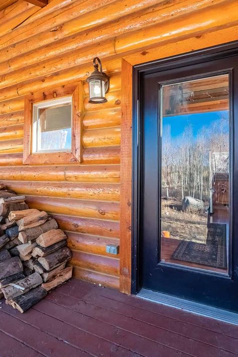 Log cabin doors are an integral part of their rustic appeal. Explore nine colors that will enhance your cabin's entrance and create an inviting, homespun feel. Log Cabin Front Door Colors, Log Cabin Front Door, Log Cabin Door, Cabin Front Door, Purple Front Doors, Brown Front Doors, Log Cabin Exterior, Cabin Door, Rustic Cabins