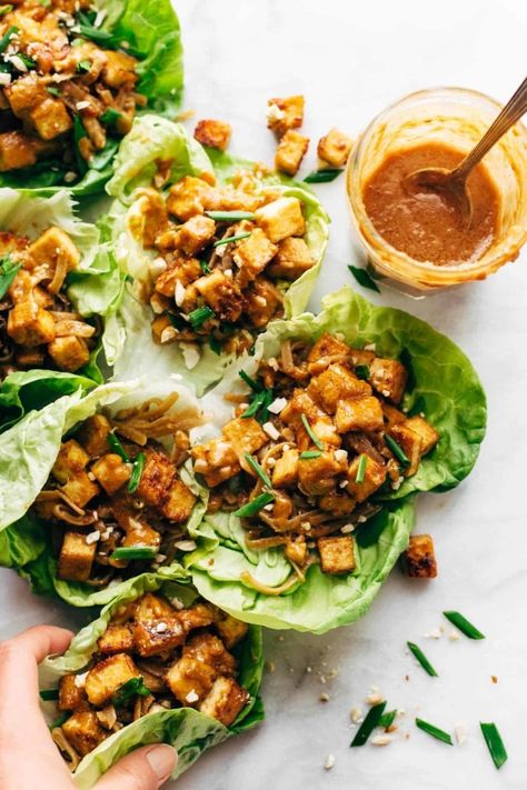 HELLO YUM. Firecracker Lettuce Wraps that are happily vegan - with crispy tofu bits, saucy brown rice noodles, and a creamy sesame sauce. #lettucewrap #vegan #tofu #veganlettucewrap #meatless #vegetarian | pinchofyum.com Tofu Lettuce Wraps, Brown Rice Noodles, Vegan Lettuce Wraps, Tofu Noodles, Vegan Tofu, Sesame Sauce, Vegan Beans, Butter Rice, Crispy Tofu