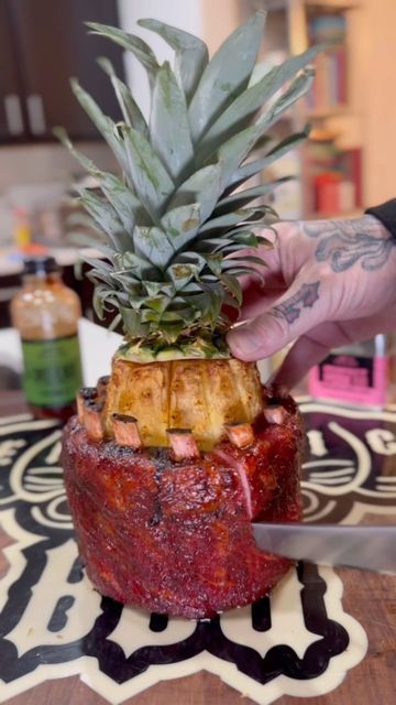 1.2M views · 36K likes | Benjamin Kendrick on Instagram: "Pineapple x Pork Ribs 🤤. This was a fun cook i did back on 12-18-23 and was inspired by my boy @svenddiesel This was one of the cooks i did that i couldn’t voiceover because i was sick. Finally have the lungs to get some editing done. Basically smoked this like the 3-2-1 rib recipe. Before i wrapped the ribs around the pineapple, i rubbed the pineapple down with some @whistlepigwhiskey syrup. First 3 hours was at 225°. Then just wrapped the whole thing in foil with apple juice to get the bone pull for almost 2 hours at 225°. Then removed from foil, sauced with Traeger Sweat and Heat BBQ Sauce and let that tack up for 45 minutes at 275°. These were delicious. Pineapple was the best part 😋 . . . . . . . . . . . #traegergrills #k Spicy Rib Wrapped Pineapple, Oven Baked Ribs With Pineapple, Pork Back Pineapple Ribs, Sweet Heat Pineapple And Rib Tacos, Pineapple Ribs Smoker, Pineapple Wrapped Ribs, Pineapple Ribs Oven, Pork Ribs Wrapped Around Pineapple, Ribs Wrapped Around Pineapple