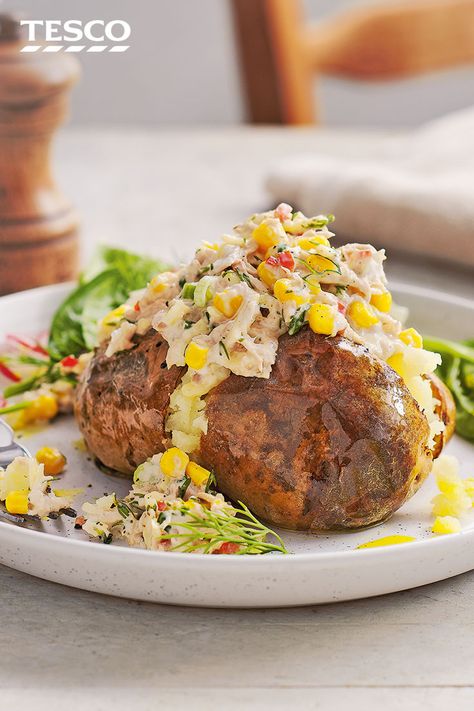 A jacket potato is a classic easy dinner – make it extra filling with this easy tuna and sweetcorn jacket potatoes. Add some heat to the tuna filling with chillies, horseradish and spring onions and serve with a crisp green salad. | Tesco Baked Potato Fillings, Tuna And Sweetcorn, Tuna Healthy, Jacket Potato Recipe, Jacket Potatoes, Potato Dinner, Healthy Dinner Ideas, Tesco Real Food, Jacket Potato