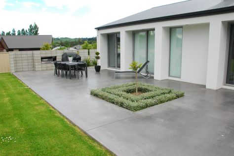 Coloured Concrete Patio in Charcoal Colored Concrete Patio, Poured Concrete Patio, Patio Landscape Design, Concrete Backyard, Design Per Patio, Cement Patio, Concrete Patio Designs, Concrete Patios, Colorful Patio