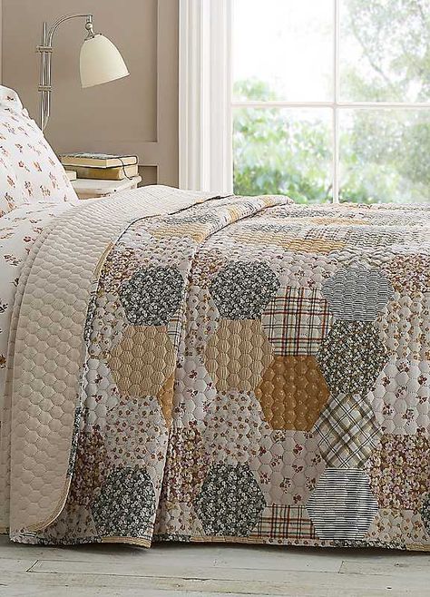 Layer your bed with a harmonious mix of floral stripes and checks with this printed patchwork design. Quilted for extra warmth, this bedspread adds comfort and infuses your sleeping space with a blend of patterns and textures.Brand: Catherine LansfieldTumble dry safeMachine washable100% Polyester Patchwork Print Duvet Cover, Patchwork Bedspread, Catherine Lansfield, Garden Bedding, Floral Stripe, Patchwork Designs, Bed Spreads, Bedroom Design, Stripes