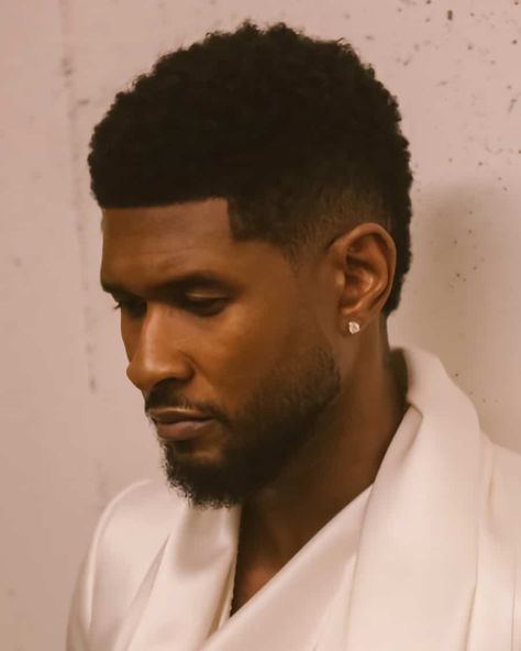 Usher short afro with low taper fade haircut. This hairstyle first appeared in the article: Low Taper Fade Haircut: What It Is & The Best Styles For 2022, on MensFlair.com Frohawk Fade, Taper Fade Afro, Crew Cut Haircut, Fade Haircut Curly Hair, Low Taper Fade Haircut, Black Boys Haircuts, Low Taper Fade, Afro Fade, Low Taper