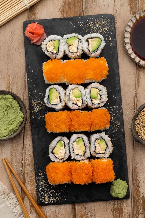 Are you looking for the perfect Vegan California Roll recipe? You've found it! This innovative version swaps crab meat for shredded tofu, providing a unique texture and taste. Topped with vegan caviar crafted from seaweed to give a burst of umami flavour, making these a crowd-pleaser for vegans and non-vegans alike. How To Roll Sushi, California Roll Recipe, Vegan Sushi Recipes, California Roll Recipes, Shredded Tofu, Rice In A Rice Cooker, Cucumber Sushi Rolls, Vegan Sushi Rolls, Make Sushi Rice