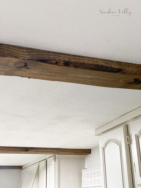 If you love the look of beams but hate the price tag that comes along with them, I'm sharing how we DIYed these real wood faux beams on a budget! Diy Wood Beams, Beam In Kitchen, Faux Ceiling Beams, Kitchen Cabinets To Ceiling, Cabinets To Ceiling, Shiplap Ceiling, Faux Beams, Faux Wood Beams, Concrete Fireplace