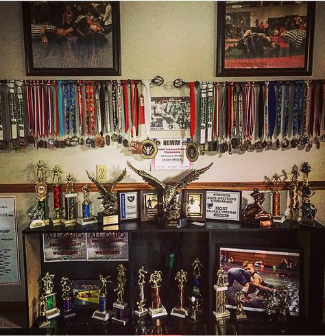 Trophy storage, curtain rod medal holders, wrestling Wrestling Room Ideas, Wrestling Room, Hammer Throw, Trophy Shelf, Trophy Case, Room Bookshelf, Sports Trophies, Trophy Display, Barbie Fairy