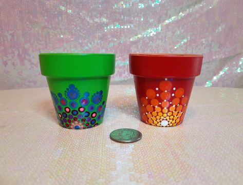 Each of these tiny flower pots is hand painted with a colorful mandala pattern.   I went with bright, Caribbean themed colors to really brighten things up!  I've sealed each pot with two coats of a high gloss outdoor sealant spray, but would advise to re-spray once a year if you choose to keep your flower pot out in the elements.  Each flower pot is approximately 1.75x1.25x1.25 inches, very lightweight, and just so darn cute!  Perfect for succulents! Purchase for yourself or as a gift! Gel Candles, Colorful Mandala, Plastic Planters, Clay Pot Crafts, Dot Art Painting, Tiny Hand, Flower Mandala, Tiny Flowers, Garden Crafts