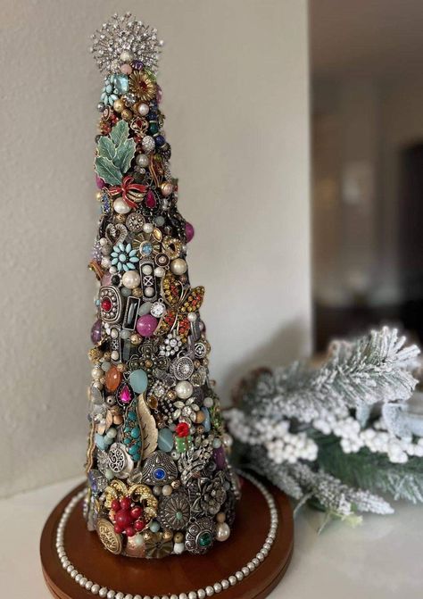 This is your sign not to toss out old and/or broken jewelry. I just finished this tree I made from some old jewelry that belonged to my mom, grandmother and great-grandmother…as well as old jewelry I had from high school and pieces I no longer wear. (20” styrofoam cone painted dark brown, pieces applied with hot glue gun) source: Teresa Lippert Ehrman Jeweled Christmas Trees, Grandmother Jewelry, Jewelry Christmas Tree, Cone Christmas Trees, Alternative Christmas Tree, Unique Christmas Trees, To My Mom, Family Jewellery, Jewelry Christmas