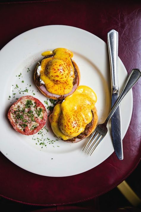 This take on eggs Benedict incorporates a rich red wine sauce. Brisket Eggs Benedict, Red Wine Poached Egg, Fancy Eggs Benedict, Gourmet Eggs Benedict, Spicy Eggs Benedict, Nola Recipes, New Orleans Recipes, Red Wine Sauce, Canadian Bacon