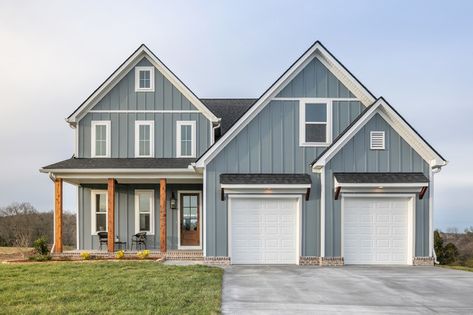 Blue Exterior House Colors Farmhouse, Blue Siding Cedar Accents, Dark Blue Hardie Board Siding, Gray Sided Houses, Light Blue Board And Batten Exterior, Blue Grey Siding Houses, Blue Siding Brown Roof, Coastal Siding Exterior, Blue House With Wood Accents