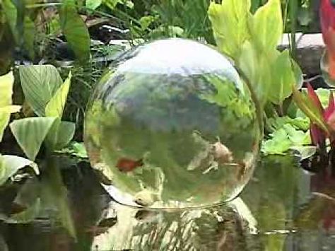 I'm doing something like this to my pond. Not sure exactly how yet. Fish Tower In Pond, Fish Tower, Garden Simple, Fish Garden, Water Gardens Pond, Backyard Pond, Garden Globes, Pond Waterfall, Pond Water Features