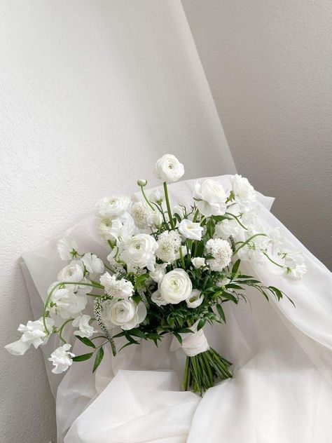 Unique White Flower Bouquet, Dainty White Bouquet, White And Ivory Wedding Bouquet, White Bride Bouquet With Greenery, White And Green Spring Bouquet, White Bouquets For Bridesmaids, Wedding Bouquets White And Green Simple, Simple White And Green Bridal Bouquet, Ranaculus Bouquet White