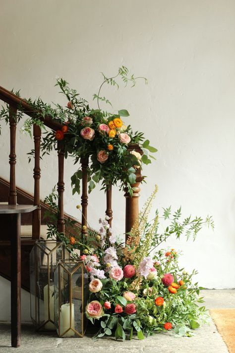 Oranges, Pinks and Purples decorating the stairs for a wedding at Pennard House Copper Green Wedding, Wedding Stairs, Natural Wedding Flowers, Cottage Core Wedding, Green Wedding Flowers, Bath Somerset, Purple Wedding Flowers, Flower Bath, Stair Decor