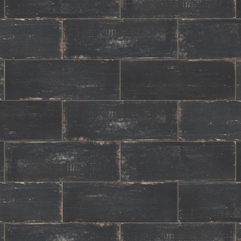 The Merola Tile Retro Nero Porcelain Floor and Wall Tile is a breathtaking addition to our collection of wood-look tiles. Crafted in Spain, the soot black glaze features a meticulously detailed grain accented in shades of tan. To add further contrast and depth, this tile has subtle bumps and grooves that echo the texture of real wood. The finishing touch on this large plank is the imitations of scuffs and spots, which gives this tile an antiquated appearance reminiscent of distressed painted woo Fireplace Facade, Rectangle Tiles, Matte Tile, Merola Tile, Tile Saw, Black Glaze, Black Tiles, Wood Look Tile, Porcelain Floor