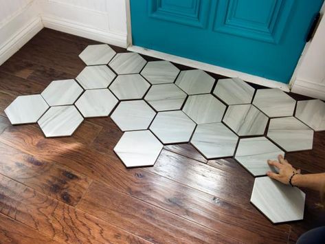 How To Install a Tile "Rug" Within a Hardwood Floor | HGTV Tile And Wood Floor Transition, Tile To Wood Transition, Octagon Tile, Honeycomb Tile, Transition Flooring, Entryway Tile, Foyer Flooring, Tile Rug, Wall Organizer