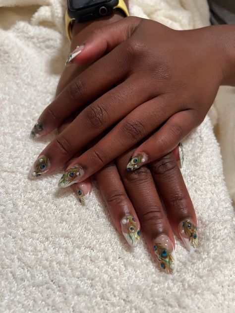 My most challenging set yet!! Beautiful pearl details ontop a french almond acrylic with peacock feathers! Peacock French Tip Nails, Fine Line Peacock Feather Tattoo, Peacock Nails Acrylic, Peacock Acrylic Nails, Peacock Nail Art Designs Feathers, Pearl French Tip, Peacock Feather Nail Art, Tip Acrylics, French Almond