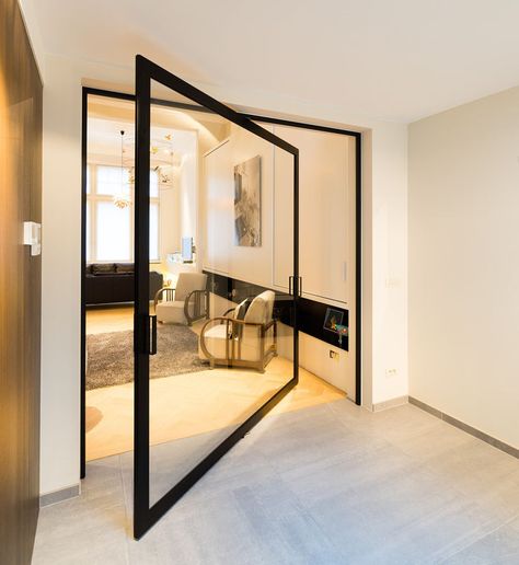 This glass pivot door has a unique central pivoting hinge that allows it to swing in both directions, enabling the doors to revolve up to 360°. Pivot Doors, Modern Mansion, Interior Door, Glass Doors, Dream Homes, Modern Area Rugs, Living Room Carpet, Black Interior, Decor Interior Design