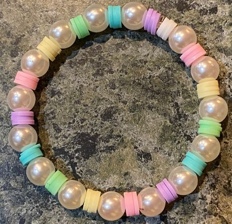 A cute beaded bracelet with pearls and rainbow pastel-colored clay beads. this will best fit on a small wrist, (older kids best age 9-14) Rainbow Bracelet Clay Beads, Bracelet Ideas For Small Business, Ideas For Clay Bead Bracelets, Ideas For Beaded Bracelets, Clay Beads Idea, Bracelet Stall, Cute Beads Bracelets, Bracelet Colors Ideas, Bracelet Ideas For Kids