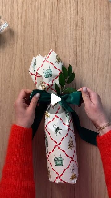 Minted on Instagram: "Never show up to a holiday party empty-handed! Save this post to reference our favorite wine bottle wrap hack from our Minted wrapping experts 🍷

Tap the #linkinbio to explore the NEW collection of wrapping paper, bows, tags and so much more." Gift Wrap Liquor Bottle Ideas, Gift Wrapping A Bottle Of Wine, Wrap A Wine Bottle With Wrapping Paper, Ways To Wrap A Wine Bottle, Creative Ways To Wrap Alcohol, How To Wrap A Bottle For Christmas, How To Wrap A Wine Bottle Gift Paper, Wrap A Bottle Gift, How To Wrap A Bottle Of Wine With Paper