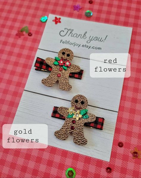 It's time for gingerbread men....hair clips that is! The listing is for one gingerbread hair clip, listed as "red flowers" or "gold flowers". The gingerbread men are made with textured, metallic brown faux leather canvas and lined with wool blended felt. The gingerbread men feature a cute smiley face, a flower/leaf accent with a Swarovski crystal centers, and 2 Swarovski crystal "buttons". The clips are fastened to a ribbon lined alligator clip and are approximately 1.5" × 1.5" Enjoy the magic of the season and have your little darling looking picture perfect for any Holiday event with these cute hair clips! Gingerbread Hair, Faux Leather Hair Clips, Leather Hair Clips, Christmas Hair Clips, Holiday Hair Clips, Glitter Hair Clips, Cute Smiley Face, Holiday Hair, Glitter Canvas