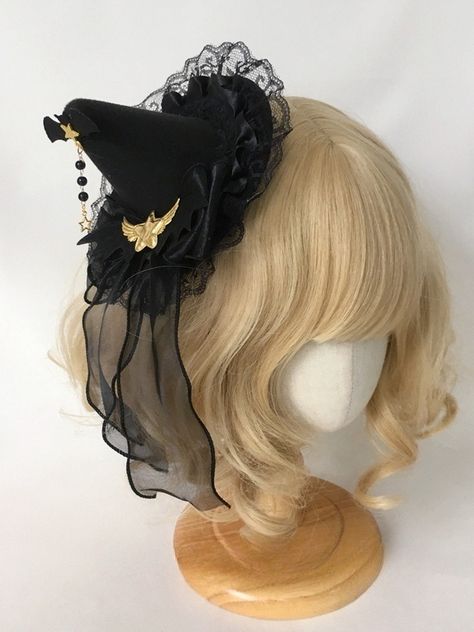 Unleash your inner sorceress with our gold stars black gothic witch mini hat. This captivating accessory is perfect for adding a touch of dark elegance to your ensemble. Crafted from high-quality, durable materials, this mini hat features a striking black base adorned with gold stars, exuding an aura of mystical allure.  Whether you're attending a gothic-themed event, a Halloween party, or simply embracing your witchy aesthetic, this mini hat is the perfect finishing touch to your bewitching loo Witch Aesthetic Hair, Witch Cosplay Ideas, Witch Hat Outfit, Witch Hat Aesthetic, Witch Hairstyles, Small Witch Hat, Little Witch Hat, Star Hats, Witch Hat Costume