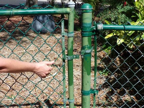 How to Replace a Chain Link Fence Gate - iFixit Repair Guide Diy Stucco Exterior, Diy Stucco, Galvanized Fence Post, Galvanized Fence, Metal Fence Gates, Chain Link Fence Gate, Aluminium Gates, Gate Hinges, Stucco Exterior