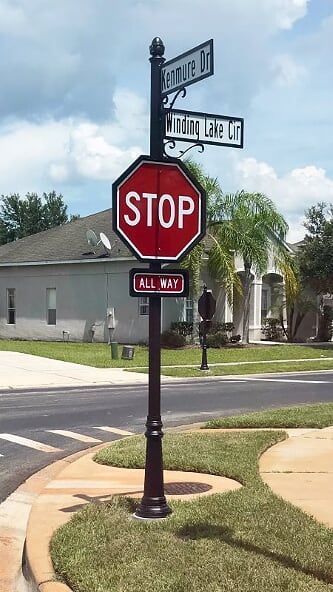 The Town Square Series is the industries most upscale decorative street name or traffic sign pole. This combination includes an acorn topper, sign frames for both the stop sign and all way sign, and decorative frames and custom street name signs. #streetsignage #streetscapes #signs #hoa #homeowners #streetsigns #speciallite Street Name Sign, Entrance Signage, Park Signage, Wayfinding Signs, Signage System, Directional Signs, Stop Sign, Custom Signage, Traffic Signs