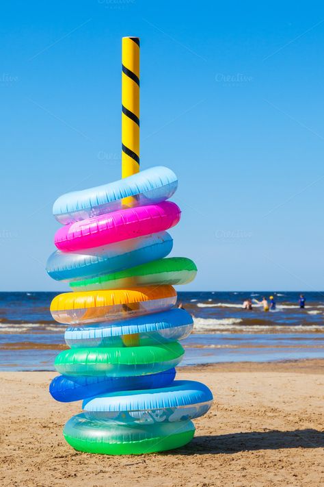 #Swimming rings  Stack of colorful inflatable swimming rings on sea beach Graphic Deisgn, Rings Stack, Swimming Ring, Swim Ring, Summer Ideas, Sea Beach, Drink Holder, Water Park, Motion